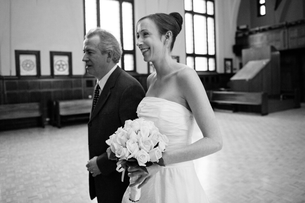 Bride and father walking in