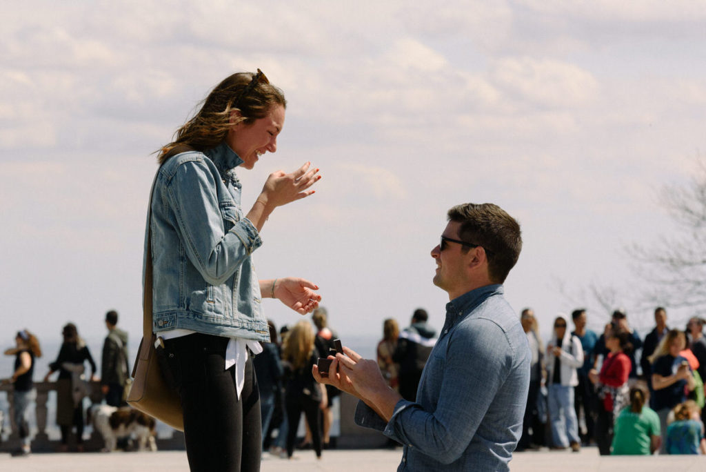 Proposal at Mount Royal lookout with crowd behind