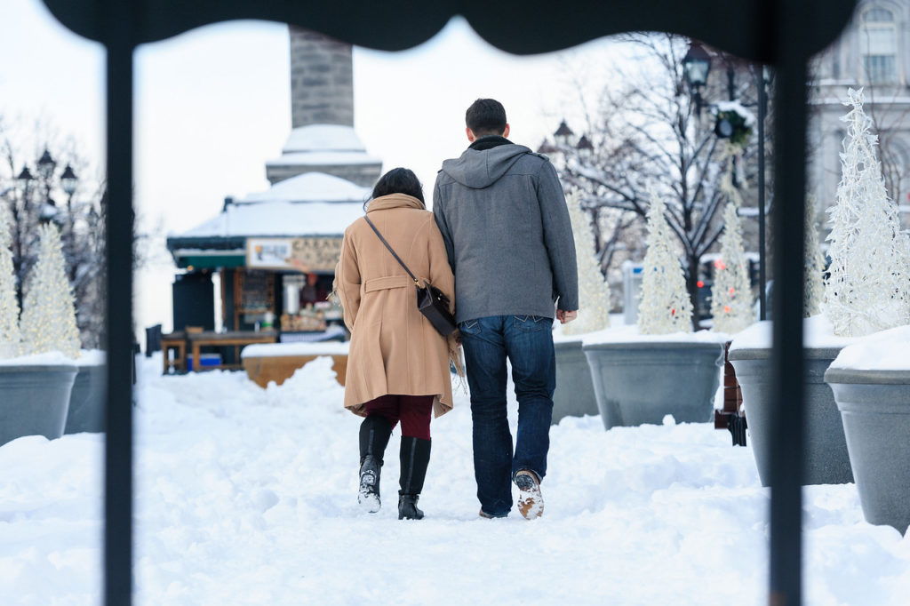Couple walking in the snow in Old Montreal