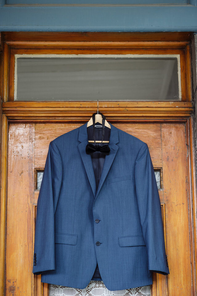  Groom's suit hanging on his doorway