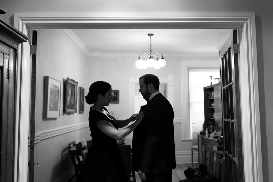 Groom's sister helping him get ready