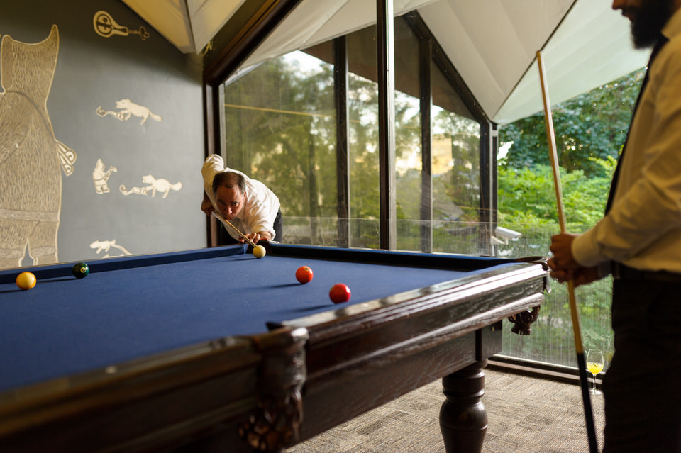  Wedding guest playing pool at La Toundra wedding venue 