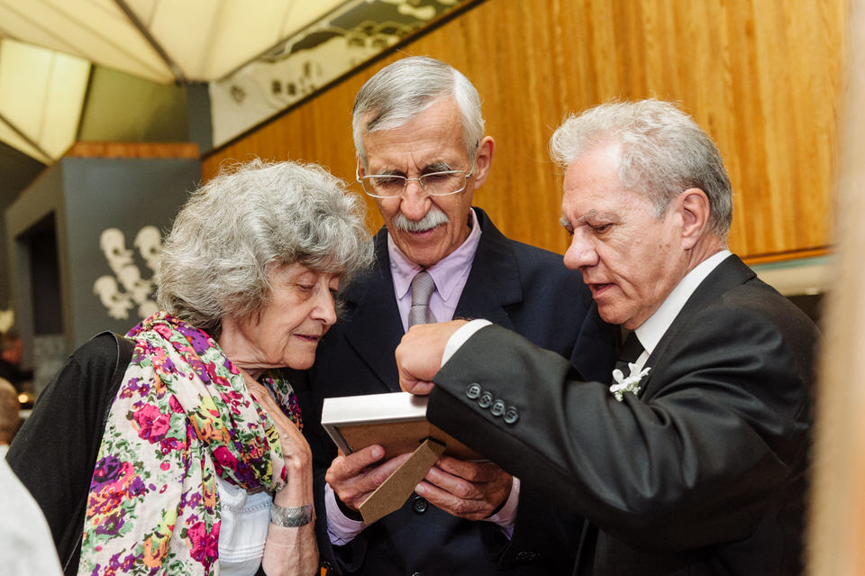 Wedding guests looking at family photos at La Toundra wedding venue