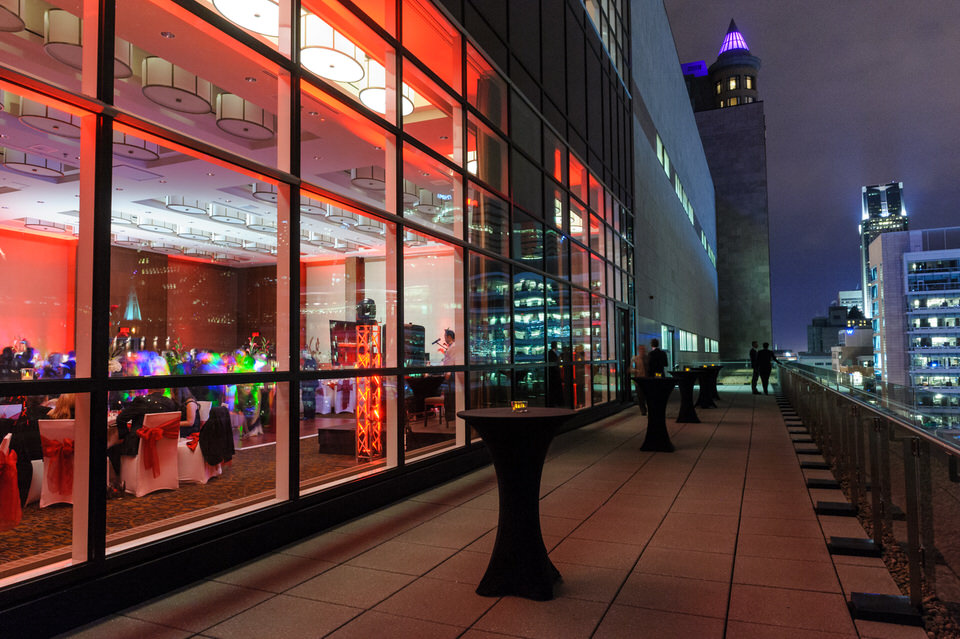 Terrace of Le Westin Montreal reception hall with view of city skyline at night