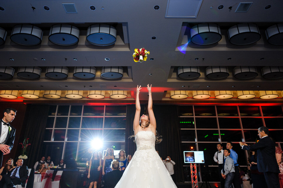 Bride tossing the bouquet at Le Westin Montreal wedding reception