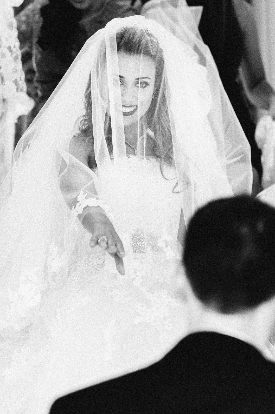 Bride descending stairs to meet the groom