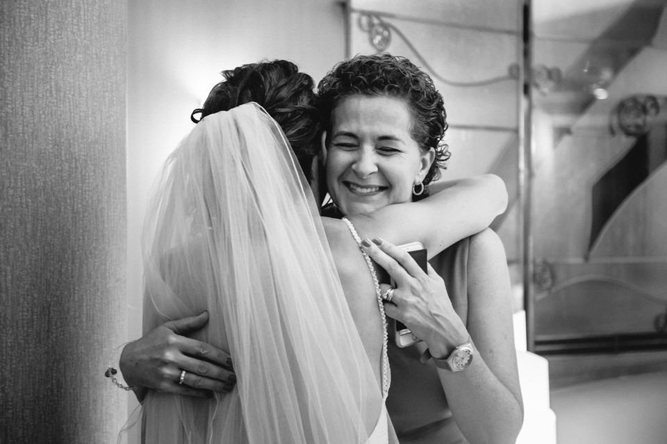 Bride hugging family member