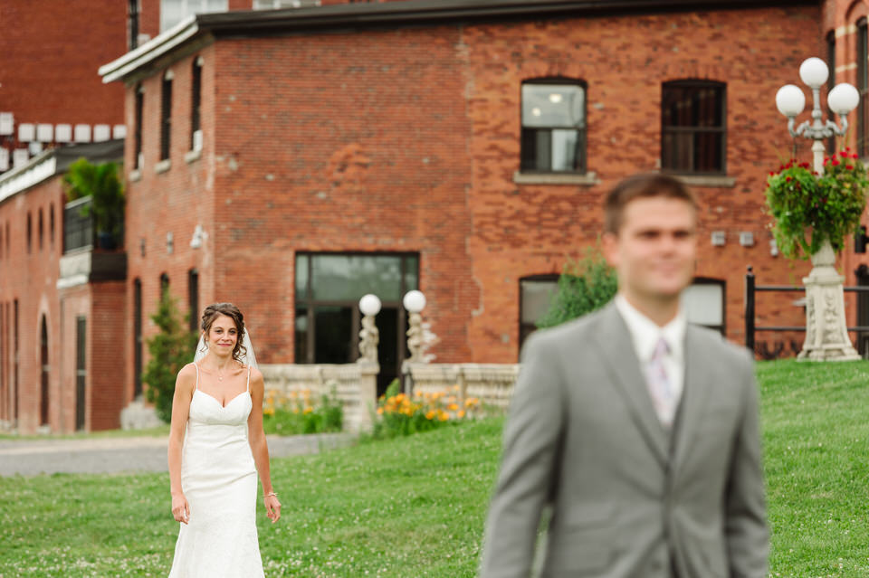 Bride walks up behind groom