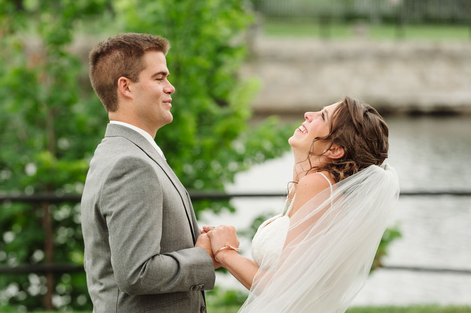 Wedding couple holding hands with excited faces