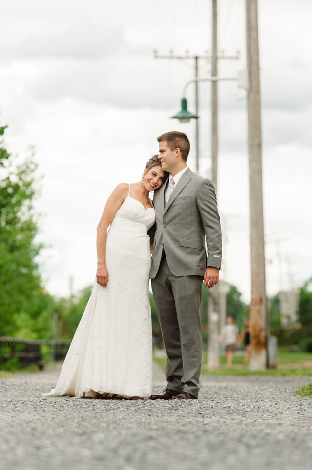 Vertical shot of wedding couple along Lachine Canal bike path