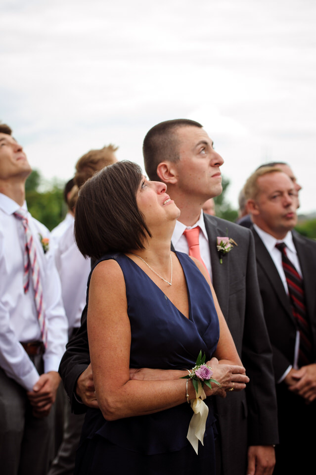 Bride's mom and brother emotional as they watch the balloons rise