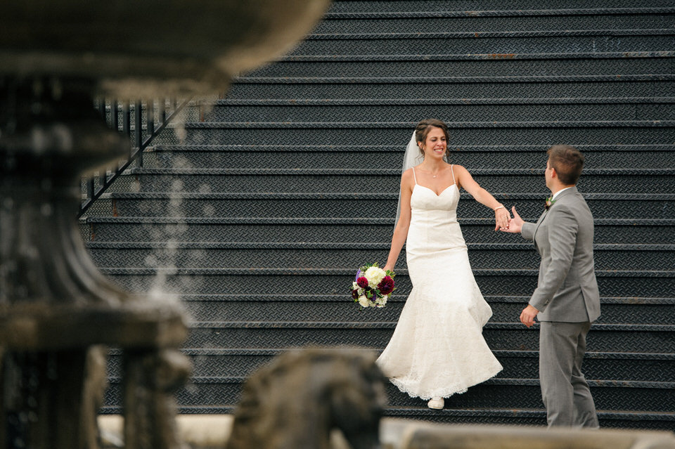 Groom reaching out his hand to bride as she arrives