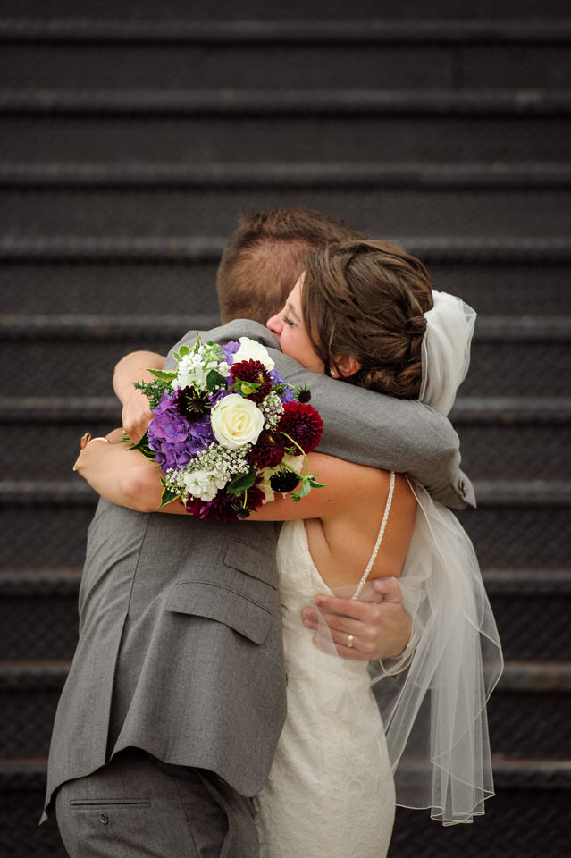 Wedding couple hugging after they just got married