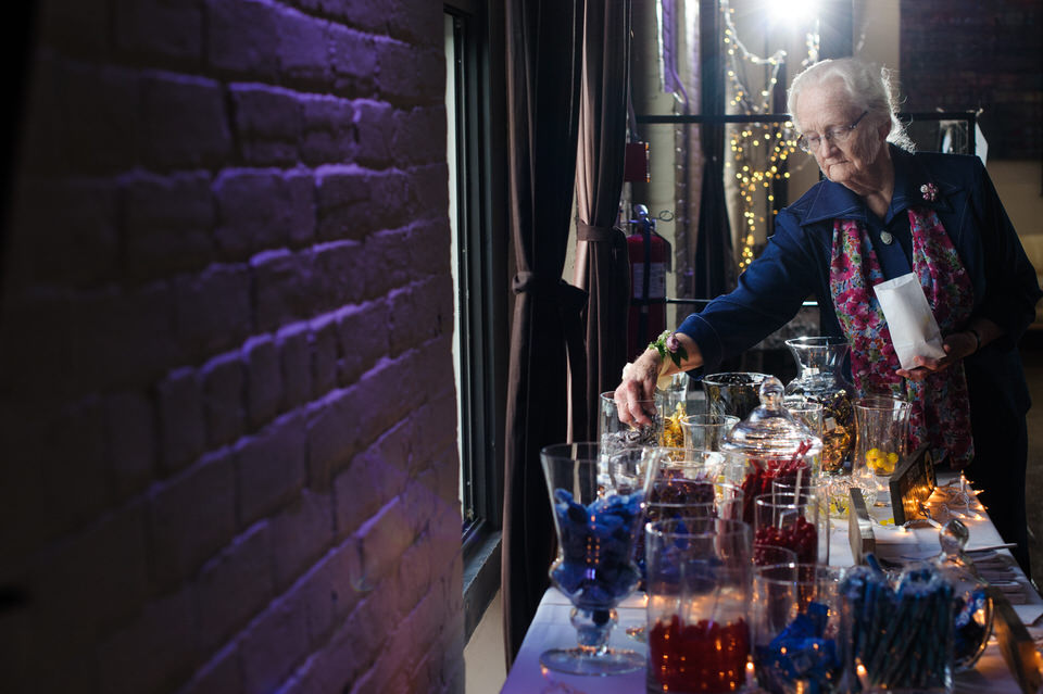 Grandmother getting candy from a sweet table