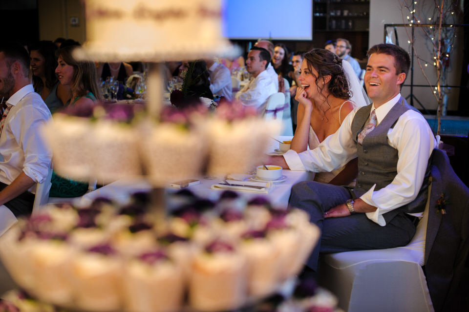 Bride and groom listening to speeches