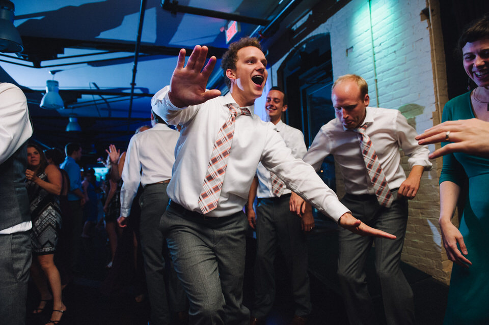 Groomsman dancing at Espace Canal