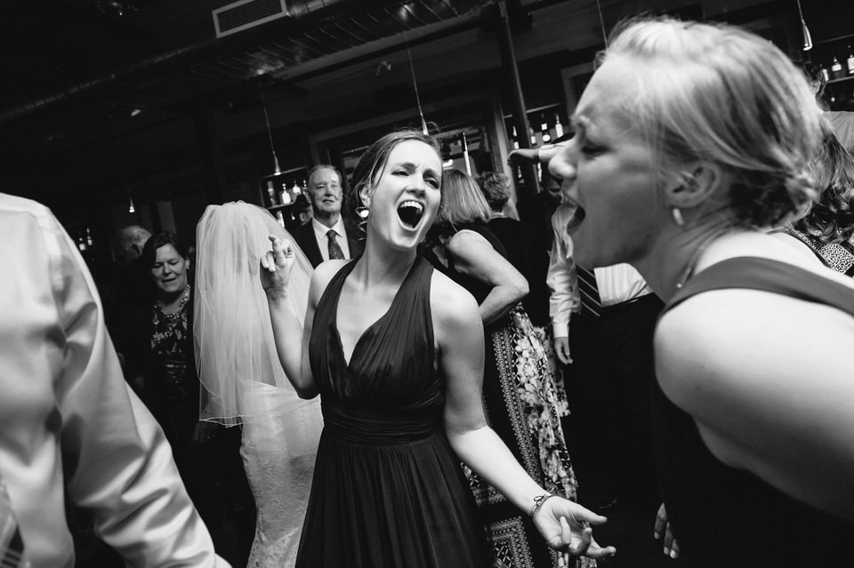 Bridesmaids singing on the dance floor