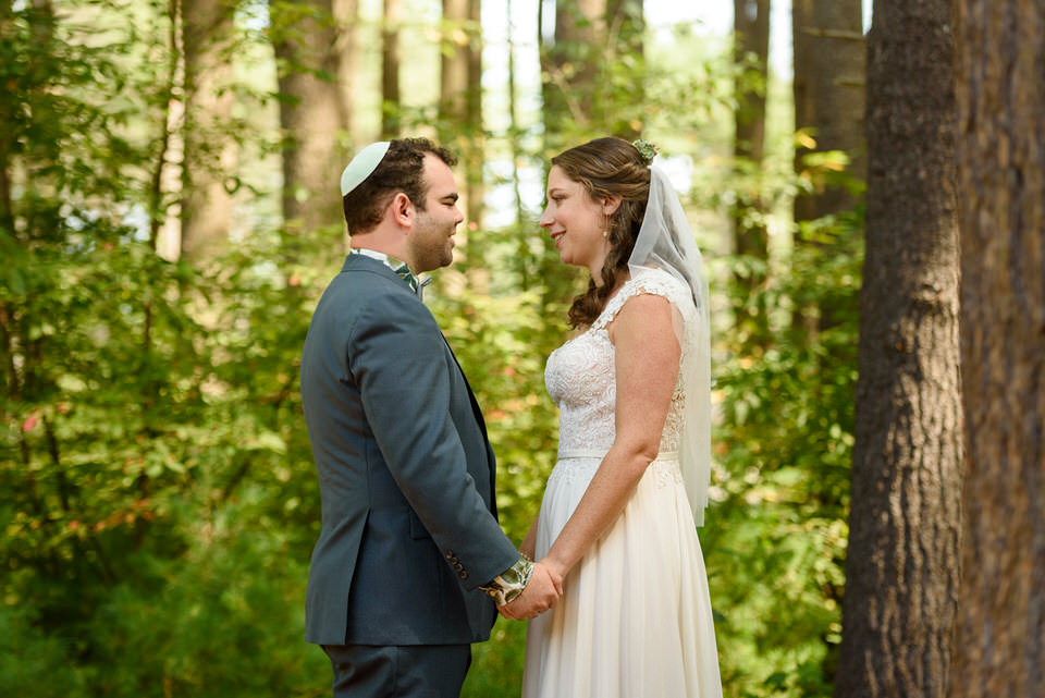 First look photo in the woods on wedding day