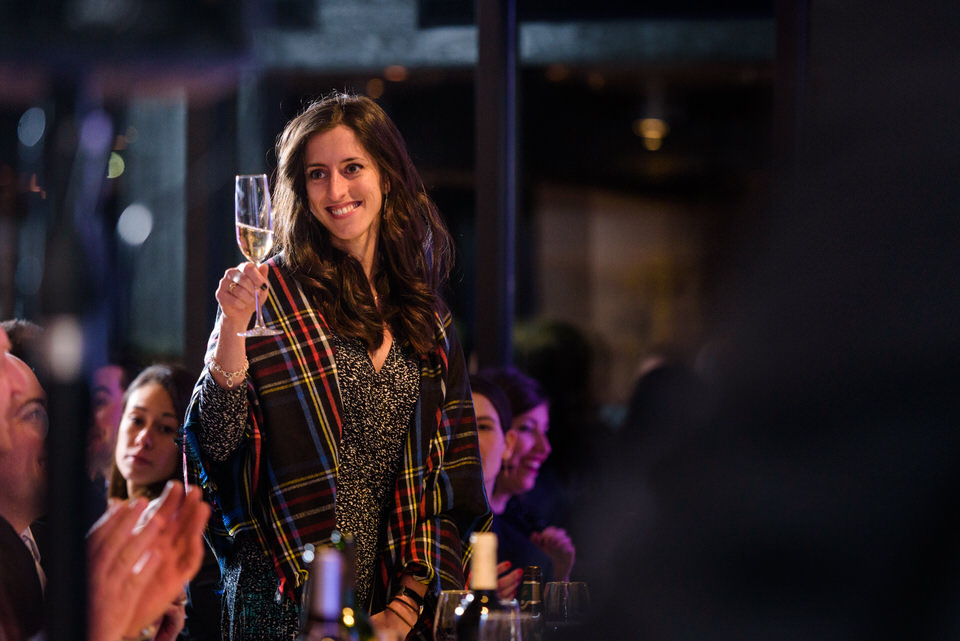 Woman raising champagne glass