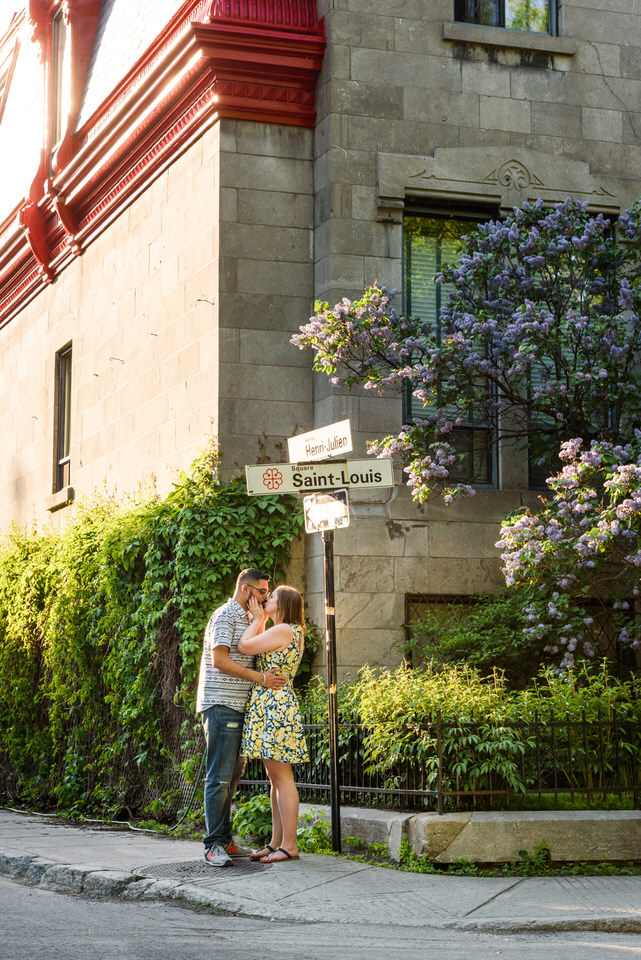 Couple kissing on the street corner at Carré Saint-Louis