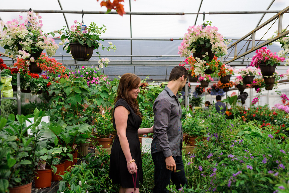 Couple wandering through greenhouse at Atwater Market