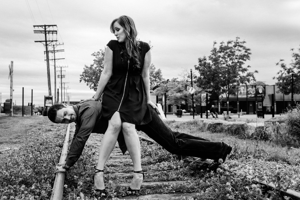 Man doing push-ups with his girlfriend sitting on his back