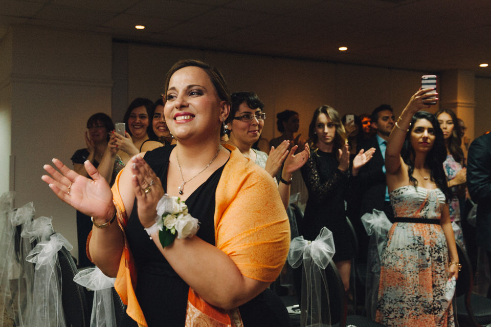 Guest clapping during ceremony