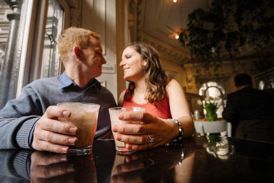 Couple drinking coffee inside Tommy Cafe