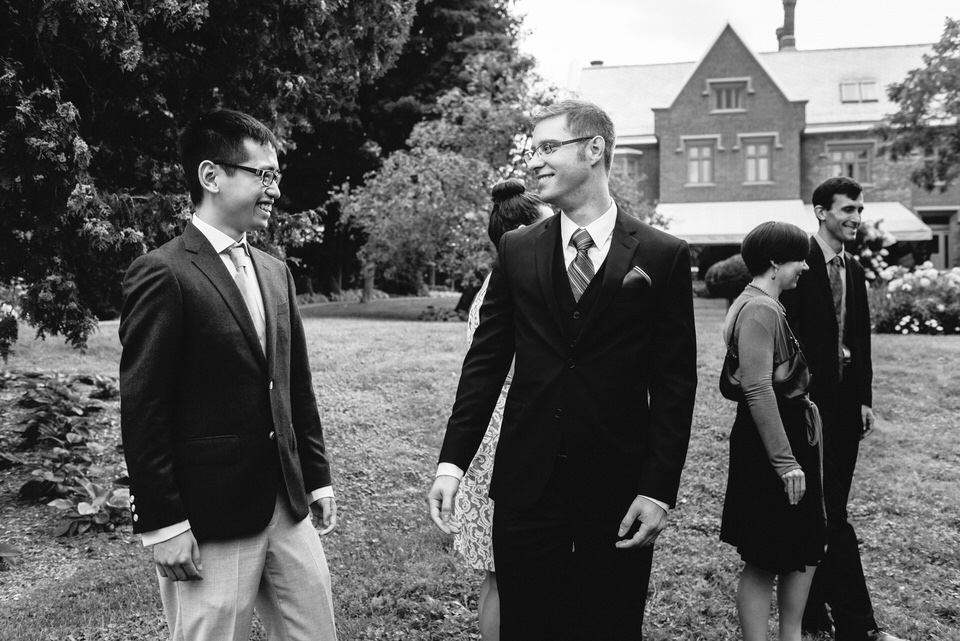 Groom laughing with friend