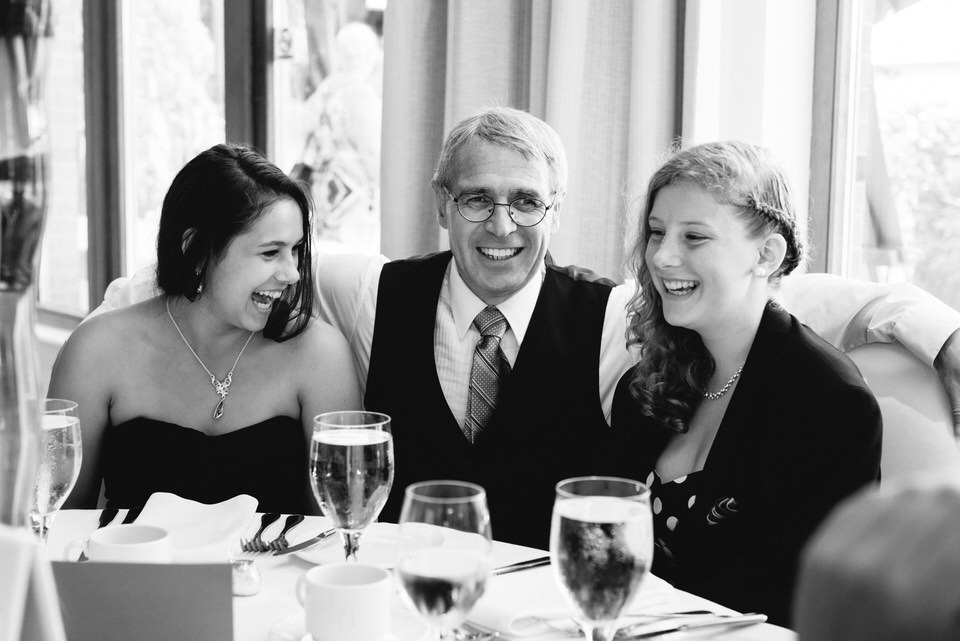 Wedding guests chatting at table