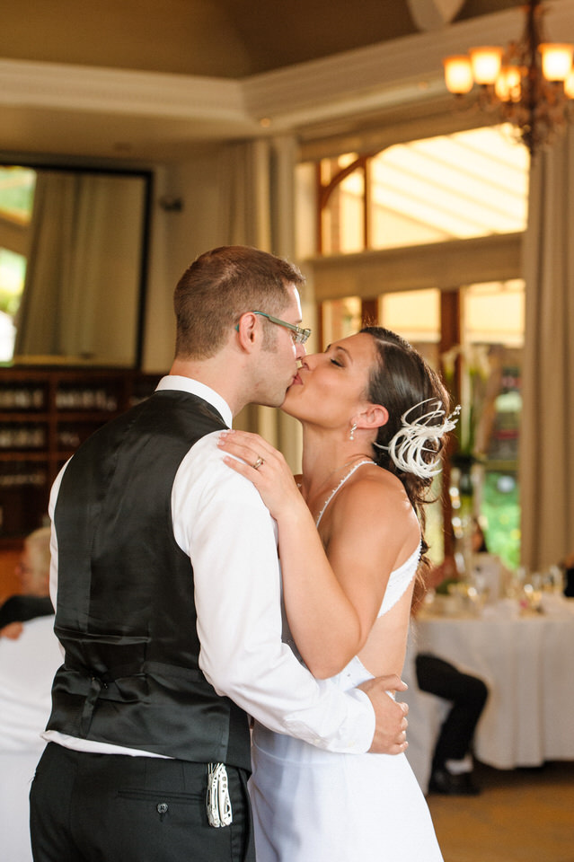 Wedding couple kissing on dance floor