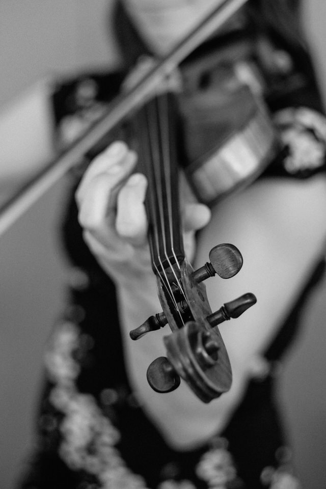 Black and white photo of wedding musician playing