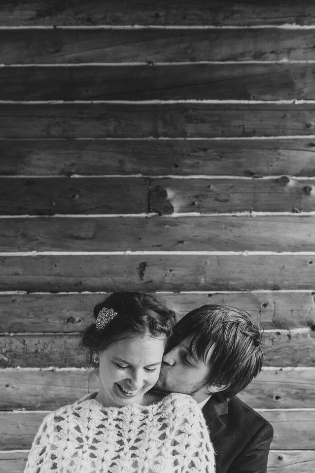 Rustic wedding photo with log cabin