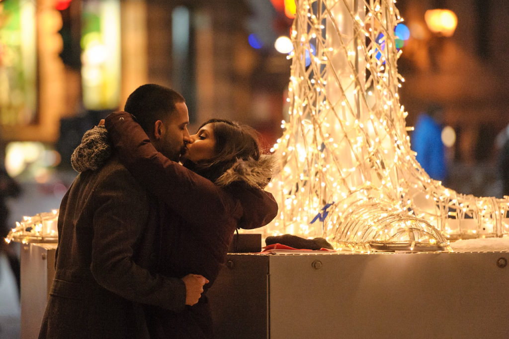 Couple kissing after proposal in Old Montreal