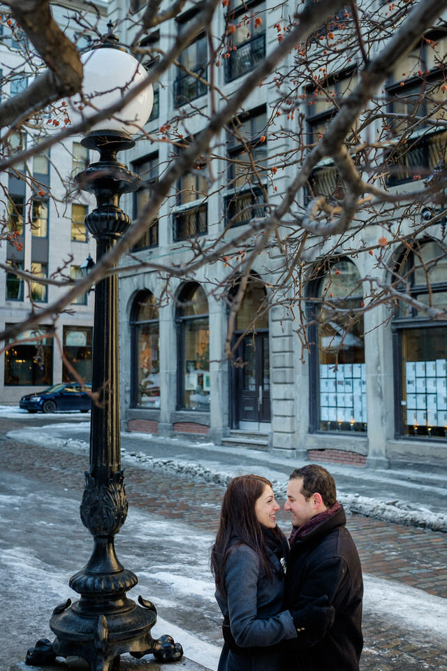 Couple hugging happily in old Montreal port