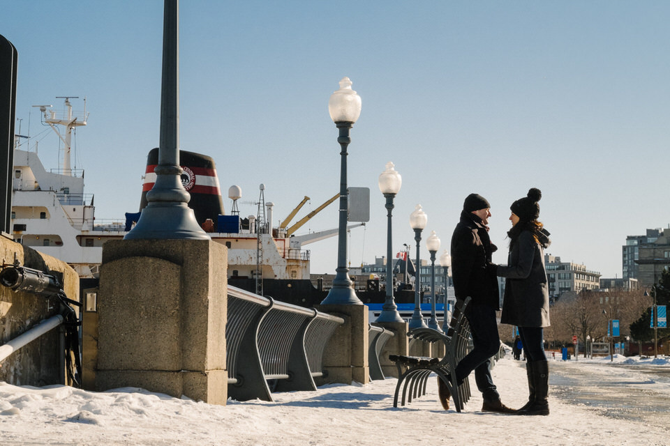 Couple holding hands in the old Montreal port