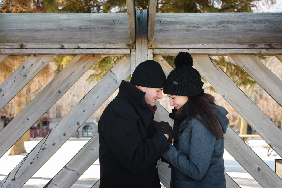 Engaged couple holding hands