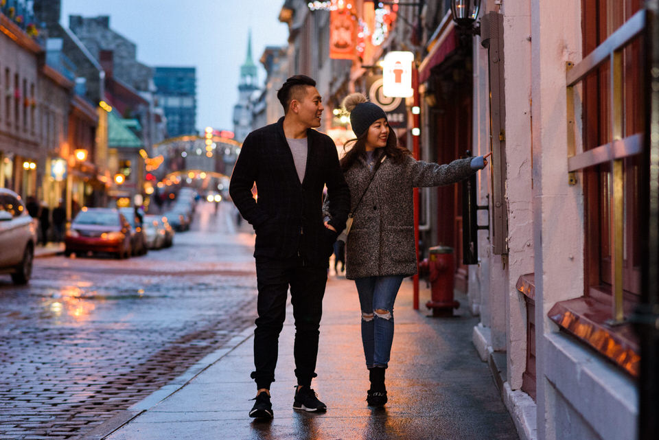 Couple walking in Old Montreal and checking out restaurants