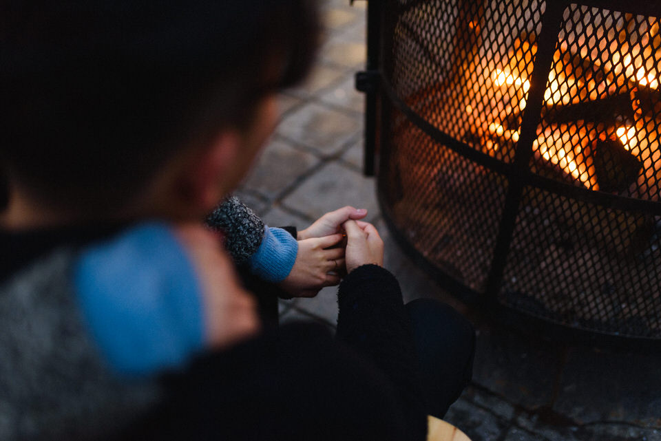 Cozy cuddling by an outdoor fire pit in Old Montreal