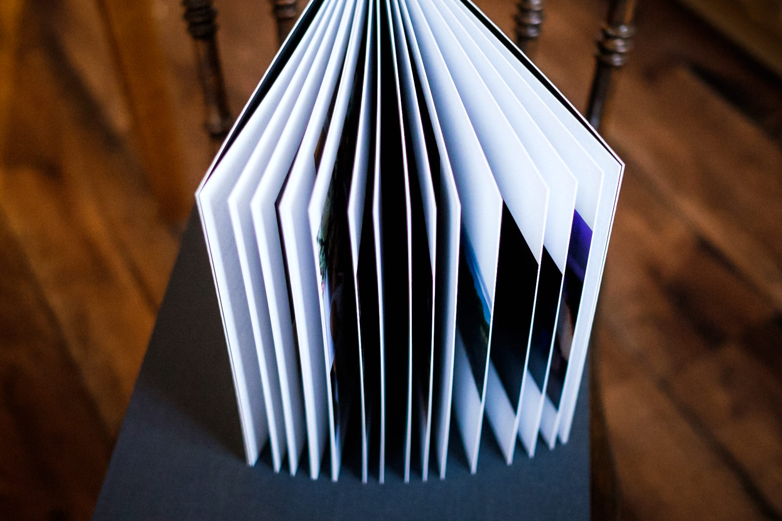 Thick pages of a wedding album fanned out