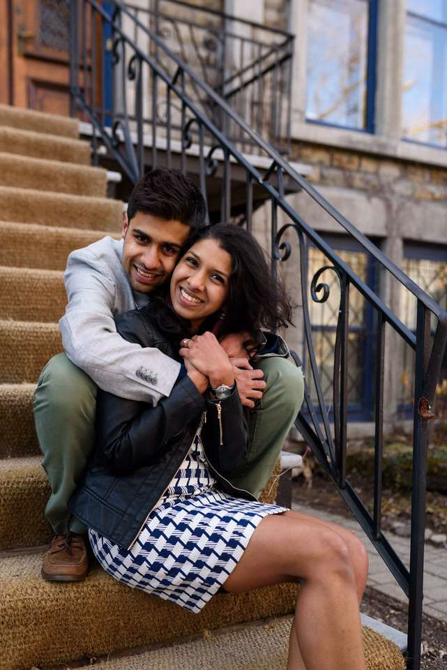 Couple sitting on stairs and hugging