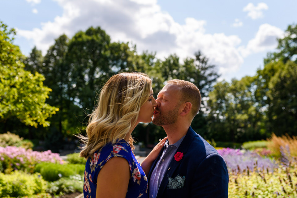 Couple kissing in the middle of flowers