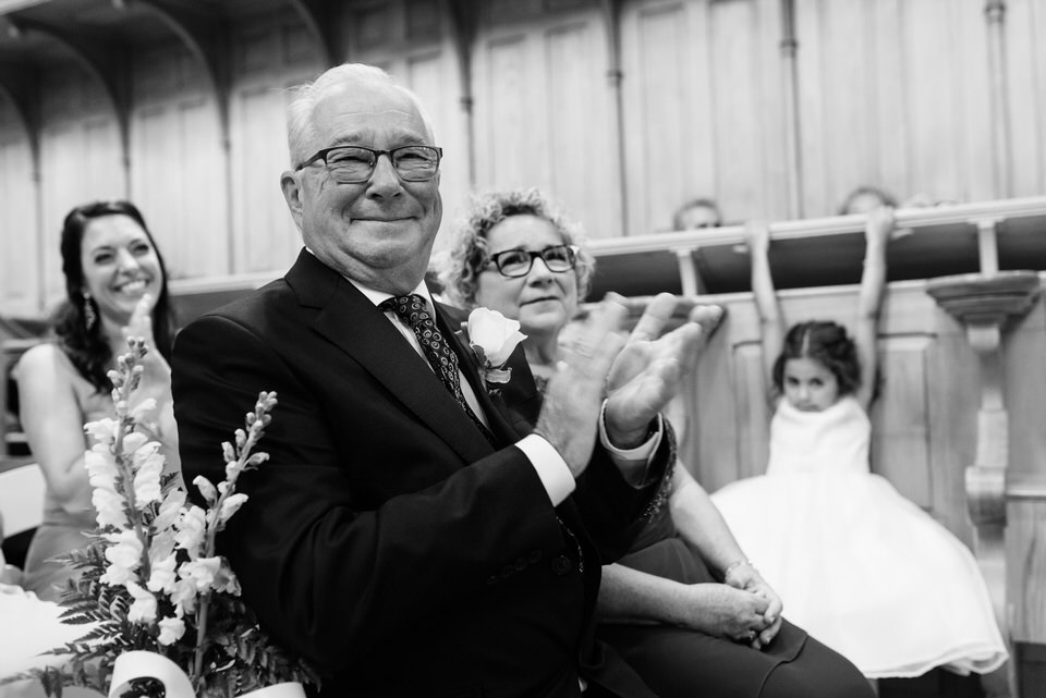 Parents clapping at wedding ceremony