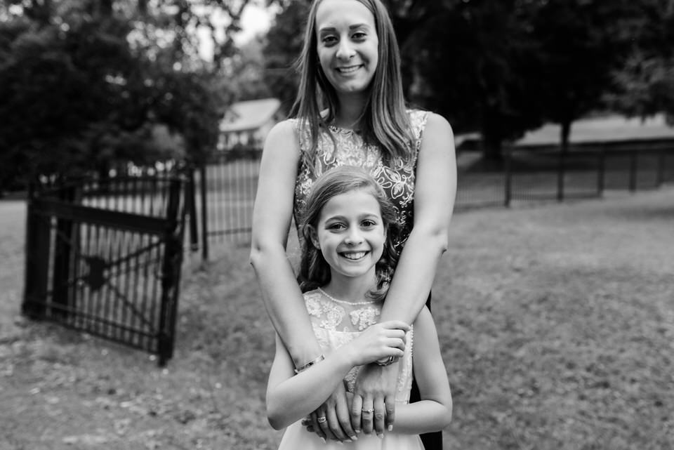 Guest hugging flower girl