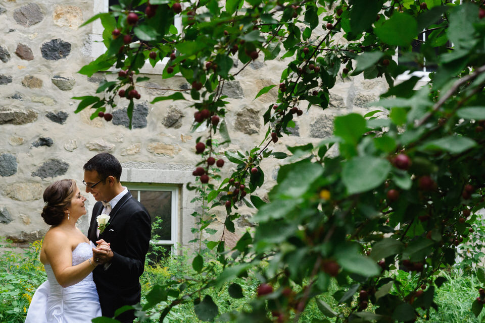 Wedding portrait in apple orchard inside Abbaye d'Oka