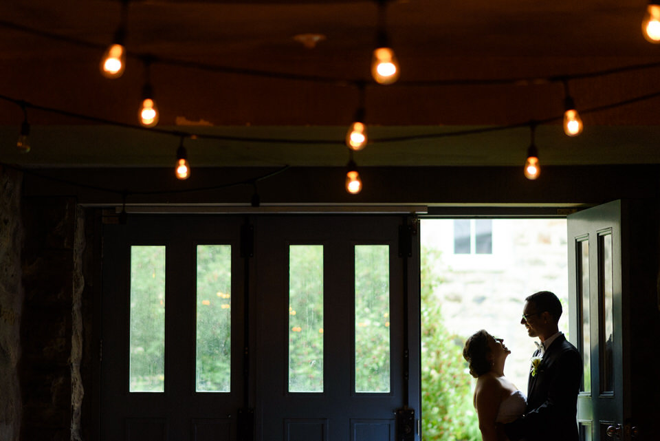 Silhouette of bride and groom in doorway