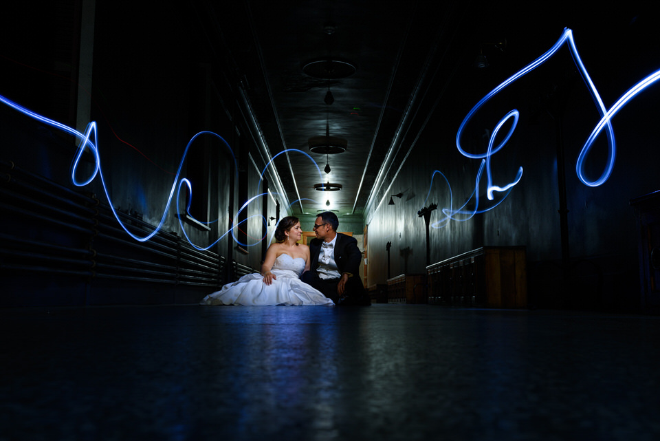 Creative night portrait of wedding couple with lights and long exposure