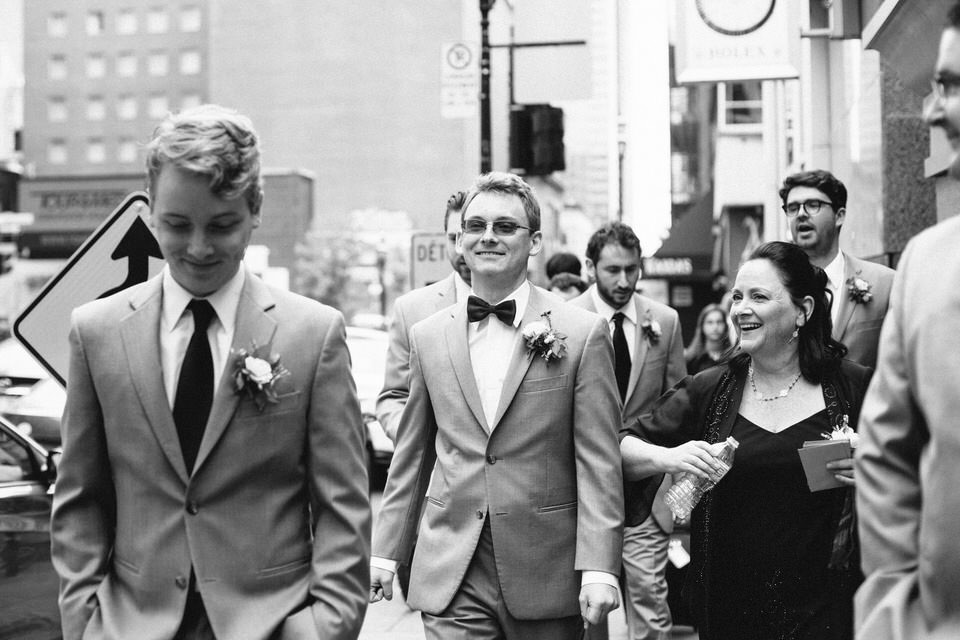 Groomsmen walking together downtown