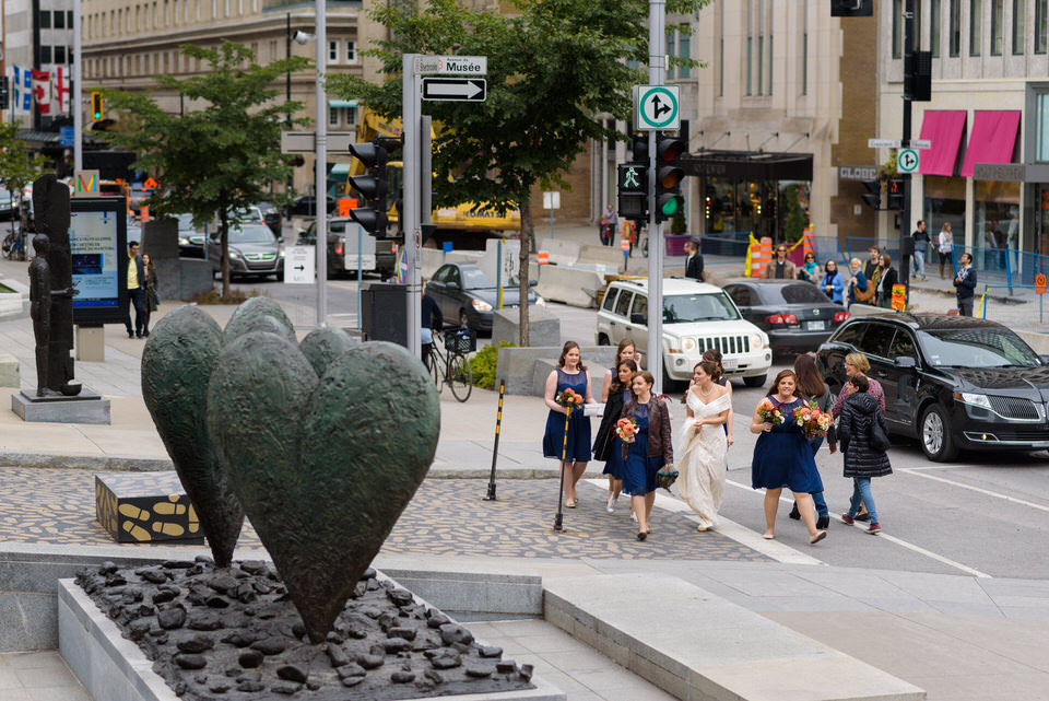 Bride and her bridesmaids walking in Montreal streets 