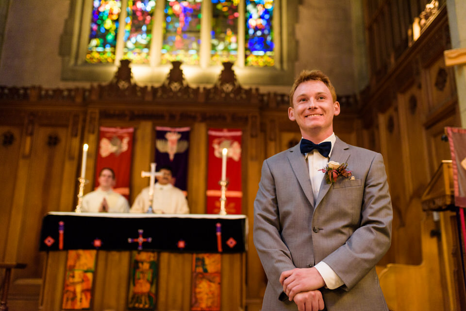 Groom waiting for bride at the aisle 